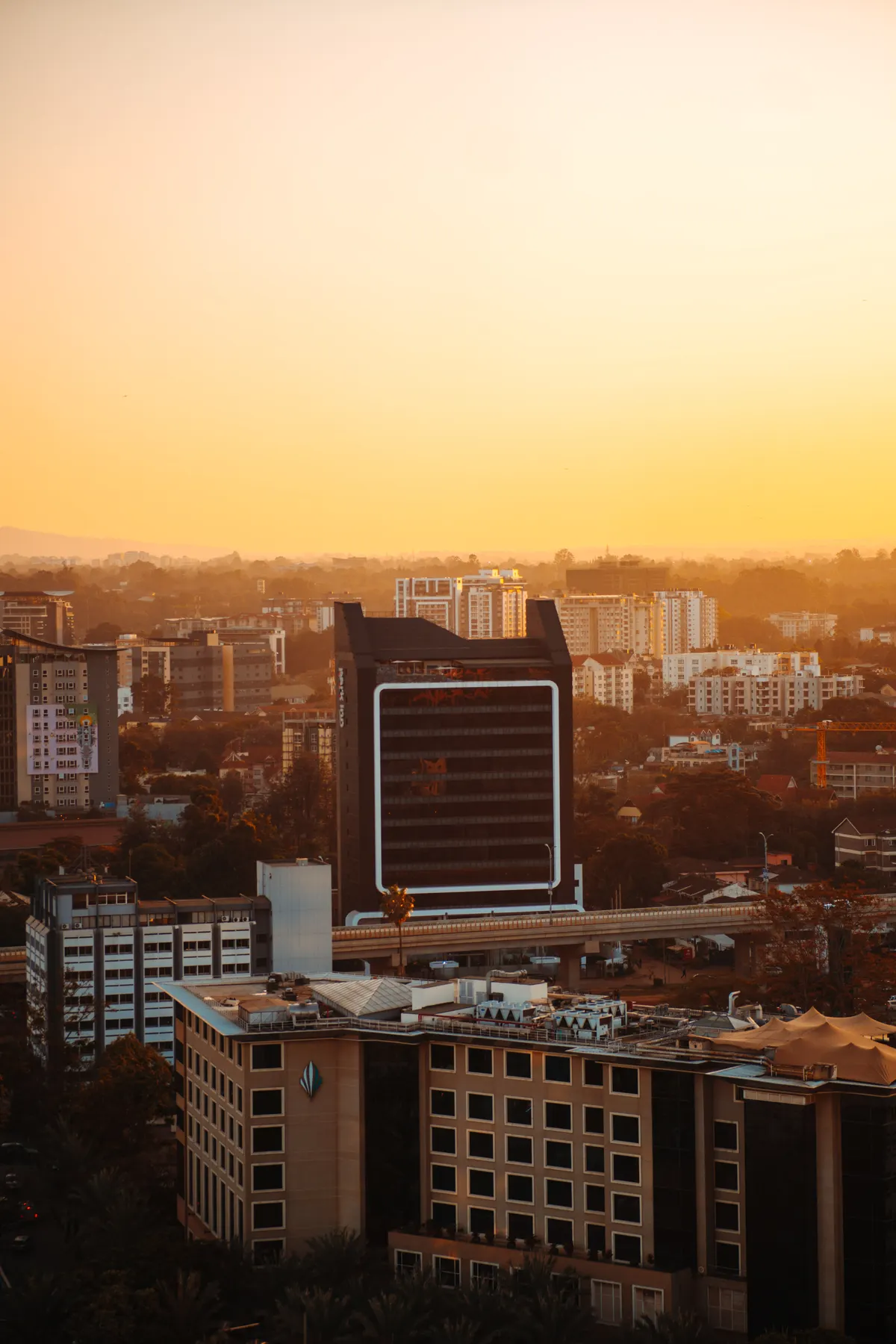 Nairobi skyline and city buildings at sunset.
